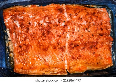 A Piece Of Salmon In The Oven, Ready To Be Served