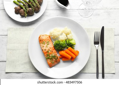 Piece Of Salmon With Vegetables On Plate, Top View