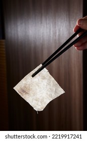 A Piece Of Shark Fin In Front Of A Dark Background