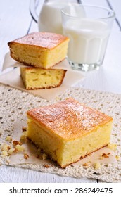Piece of sweet sponge cake on paper in rustic style