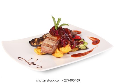 A piece of tuna with grilled vegetables. Isolated tuna on a white background.