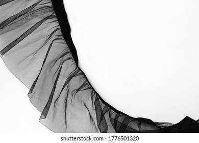 Piece of vintage black transparent mesh fabric tulle on white background, elegant dress, aesthetic textile, dark clothing, clothes lace, folded isolated veil, curtain tissue - Powered by Shutterstock