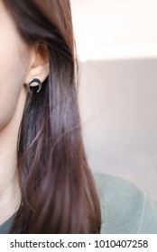 Piece Of Woman's Face. Ear With Small Earring Closeup.