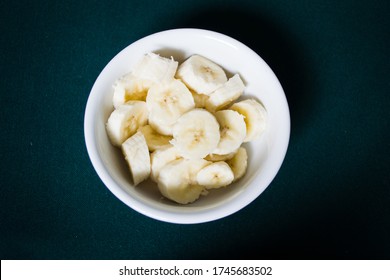 Pieces of banana in a white bowl