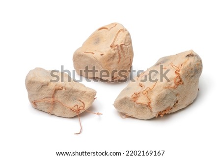 Pieces of Baobab fruit pulp close up isolated on white background 
