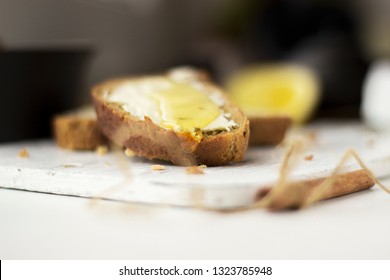 Pieces of bread with butter and honey, macro - Shutterstock ID 1323785948