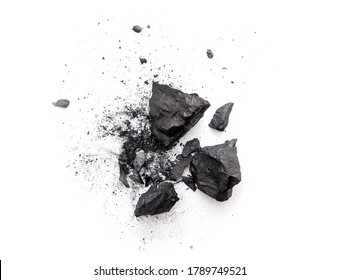 Pieces of broken black coal isolated on white background