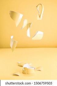 Pieces Of A Broken Yellow Mug