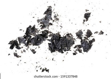 Pieces Of Burnt Paper On A White Background. The Ashes Of The Paper. Charred Paper Scraps.