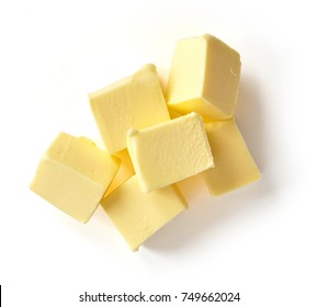 Pieces of butter isolated on white background, top view