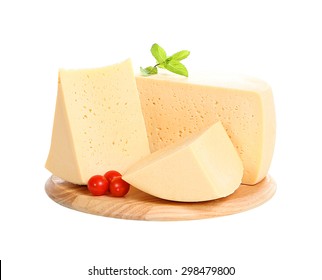 Pieces Of Cheese On A Wooden Plate Isolated On White Background