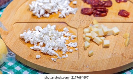 Pieces Of Cheese Samples At Bamboo Board Tray