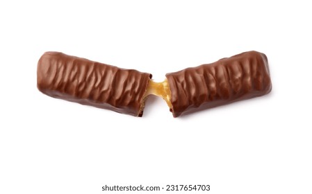 Pieces of chocolate bar with caramel on white background, top view