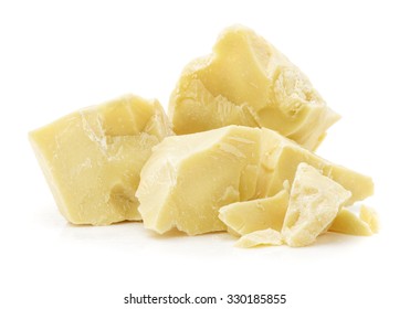 pieces of cocoa butter, close up isolated on white background, composition