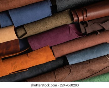 Pieces of the colored leathers. Raw materials for manufacture of bags, wallets, shoes, clothing and accessories. leather for handmade . Leather studio. - Shutterstock ID 2247068283