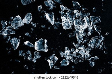 Pieces Of Crushed Ice Cubes On Black Background. Ice Debris Pattern.