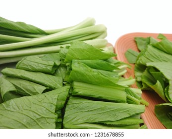 Pieces false pakchoi or mock pakchoi on chopper board isolated white background - Shutterstock ID 1231678855