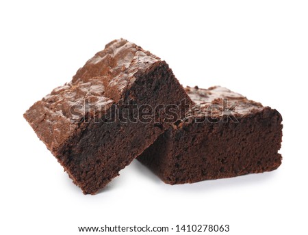 Pieces of fresh brownie on white background. Delicious chocolate pie