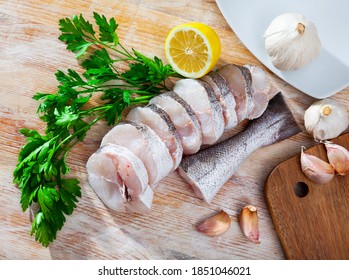 Pieces Of Fresh Hake With Seasonings Prepared For Cooking. High Quality Photo