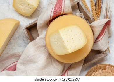 Pieces of  fresh homemade italian cheese on a tray top view