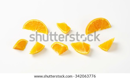 pieces of fresh orange on white background