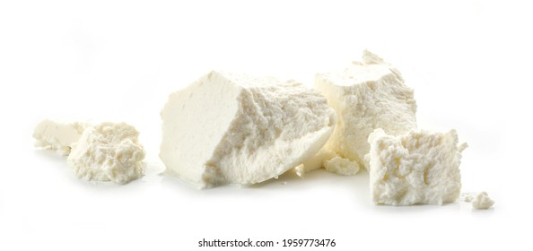pieces of fresh ricotta cheese isolated on white background - Shutterstock ID 1959773476