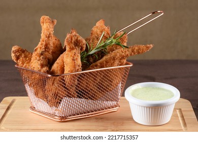 Pieces Of Fried Fish Breaded With Panko Flour Served With Herb Sauce, Cod.