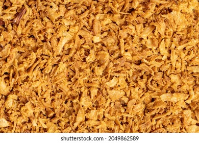 Pieces of fried onions. Top view.