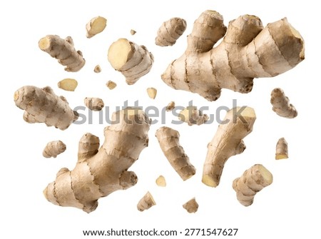 Pieces of ginger root falling in dynamic motion with natural texture, isolated on white background for food and spice visuals