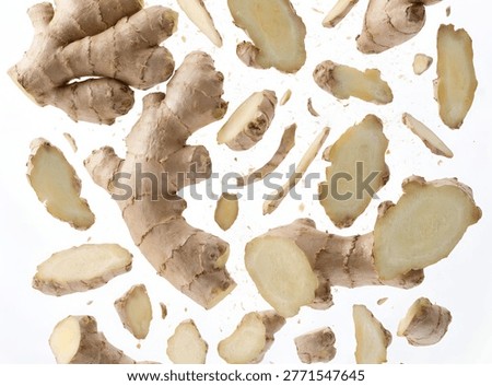 Pieces of ginger root falling in dynamic motion with natural texture, isolated on white background for food and spice visuals