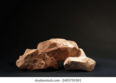 Pieces of granite stone on black background studio shot