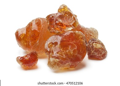 Pieces of Gum arabic on white background