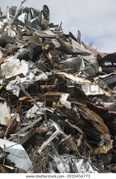 pieces of\
iron parts from scrapped cars and other metal after crushing and\
separation from other metals as a\
background