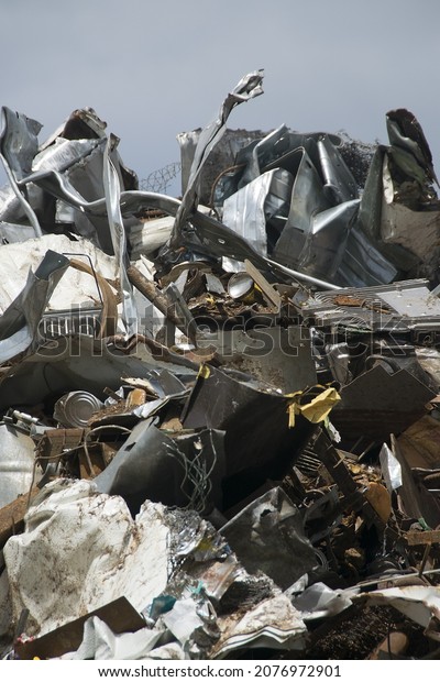 pieces of\
iron parts from scrapped cars and other metal after crushing and\
separation from other metals as a\
background