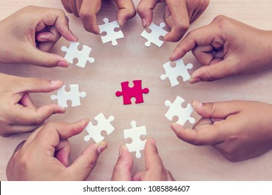 A pieces of jigsaw puzzle will be matching. Business concept. Red and white puzzles.