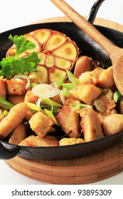 Pieces Of Marinated Chicken Breast With Garlic And Onion In A Pan
