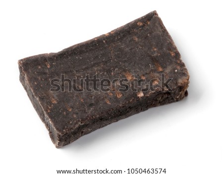 Pieces of Moroccan hashish laid on the white background