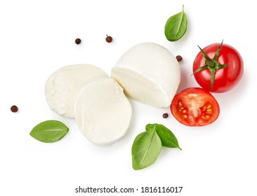 Pieces of mozzarella Buffalo cheese with basil leaves. Top view of sliced cheese with tomatoes isolated on white background.