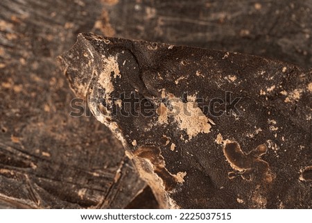 Pieces of natural dark chocolate close up