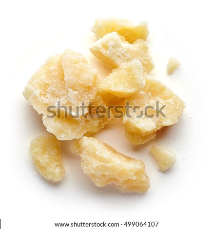Pieces of parmesan cheese isolated on white background, top view