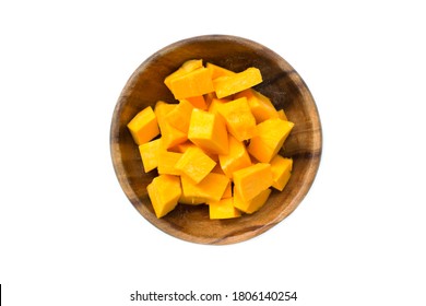 Pieces of pumpkin in a wooden saucer on a white background. View from above - Shutterstock ID 1806140254