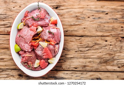 Pieces Of Raw Beef Steaks.Raw Sliced Meat.Citrus Marinade