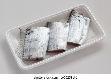 Pieces Of Raw Cutlass Fish On White Tray