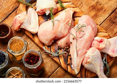 Pieces of raw poultry meat and spices for meat. Chicken meat, uncooked