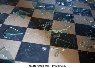 Pieces Of Shattered Glass Or Mirror In An Abandoned House On The Floor. Shallow Depth Of Field