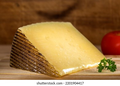 Pieces Of Sheep Milk Cheese On Wooden Background