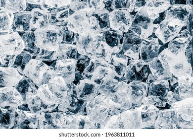 Pieces Of Shiny Crushed Ice Cubes Pattern On Black Background.