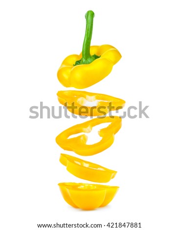 pieces of sliced yellow peppers falling in the air on an isolated white background