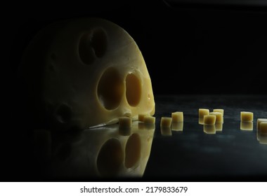 Pieces Of Swiss Cheese On Blackbackground