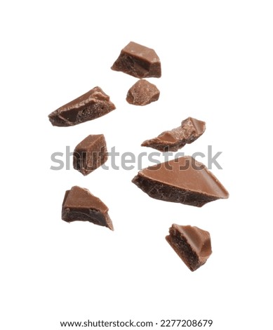 Pieces of tasty chocolate bar isolated on white